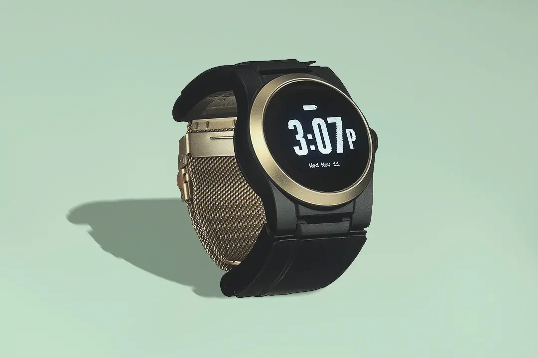 Black and gold watch with digital display