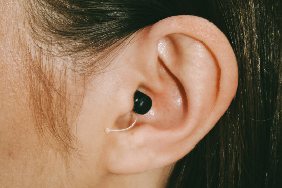 Eargo hearing aid in white woman’s ear