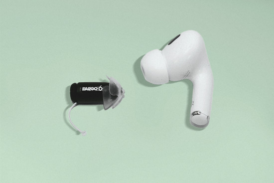 Eargo hearing aid next to a wireless earbud