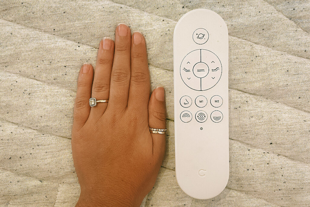 The Casper Adjustable Base Pro remote size compared to a hand