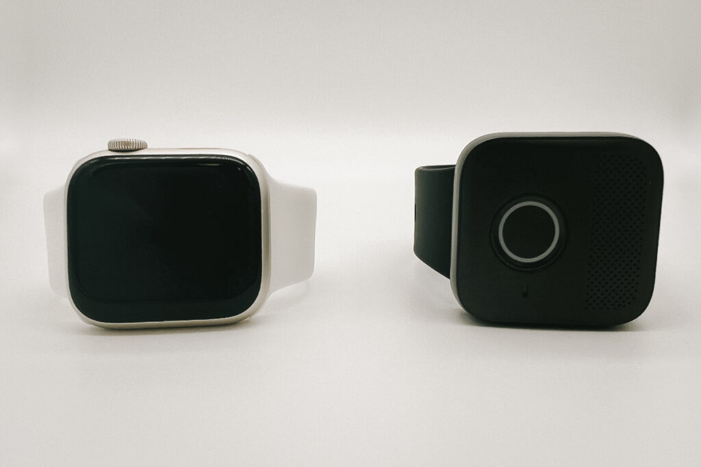 An Apple Watch and MGMini Lite next to each other