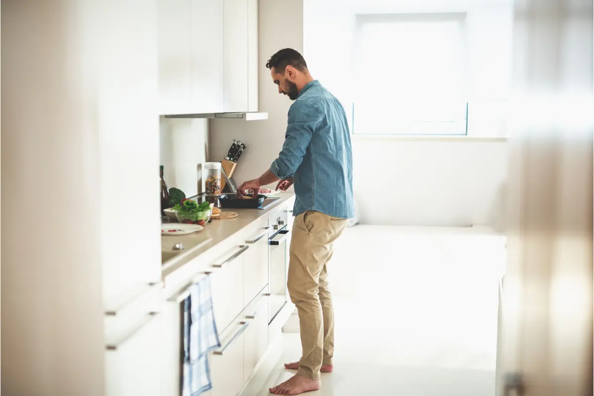 Man making a meal in his kitchen